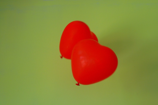 Two heart shaped red balloons